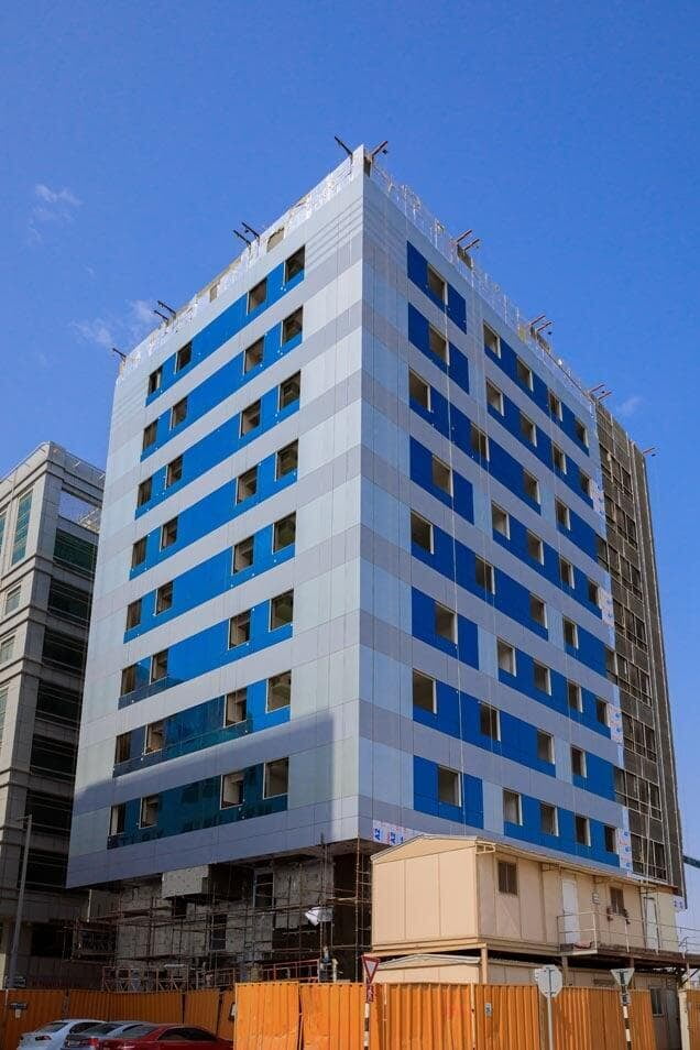 Omeir commercial and residential building exterior with ALUCOPANEL cladding