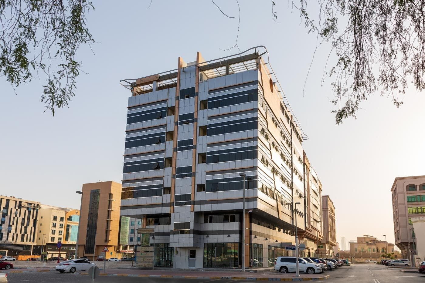 Four storey commercial building exterior with ALUCOPANEL cladding