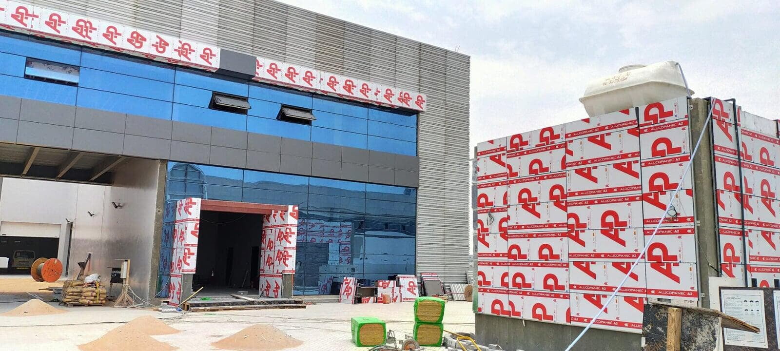 Warehouse and office exterior with ALUCOPANEL cladding, Production City