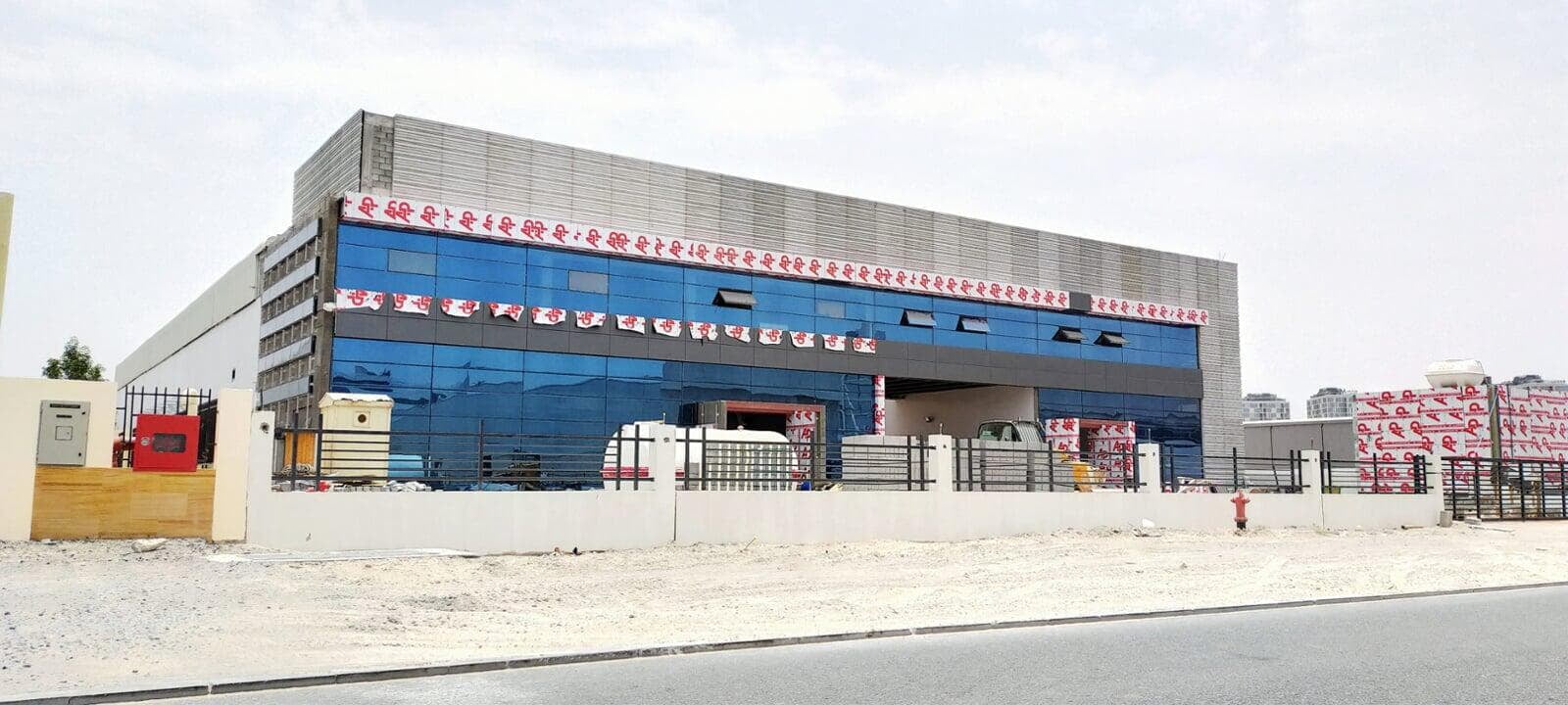 Warehouse and office in Production City, Dubai, clad with ALUCOPANEL