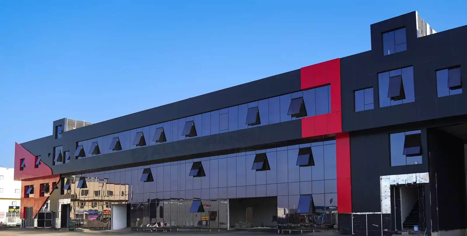 Black facade with red accent panel, ALUCOPANEL FR, Umm Al Quwain