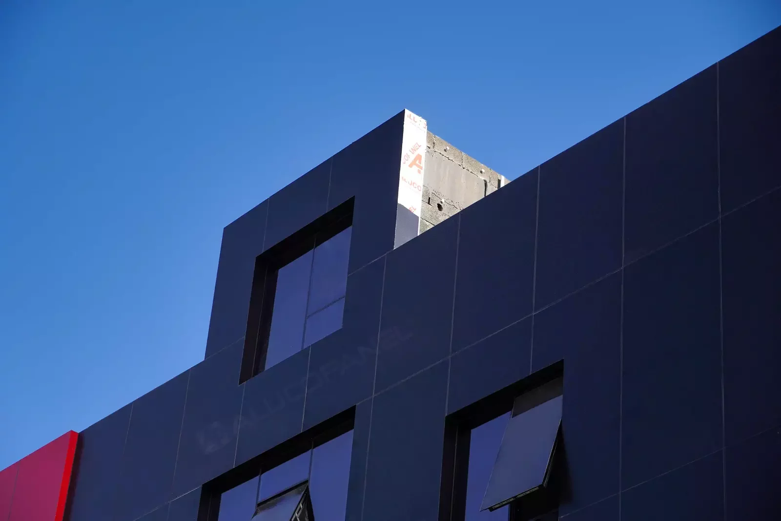 Black ALUCOPANEL FR cladding, upper facade detail, Umm Al Quwain