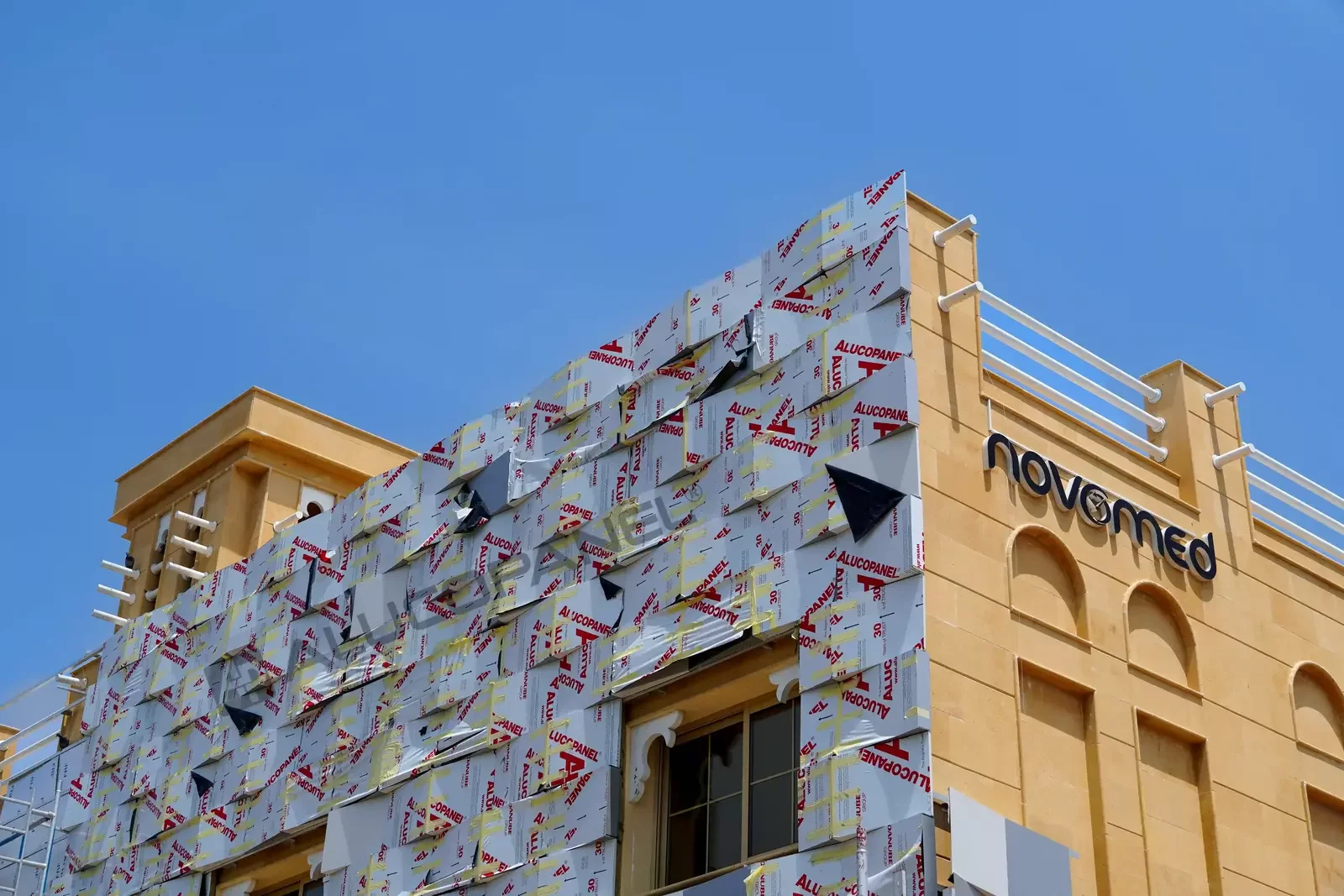 ALUCOPANEL cladding being installed on the Novamed building, Dubai