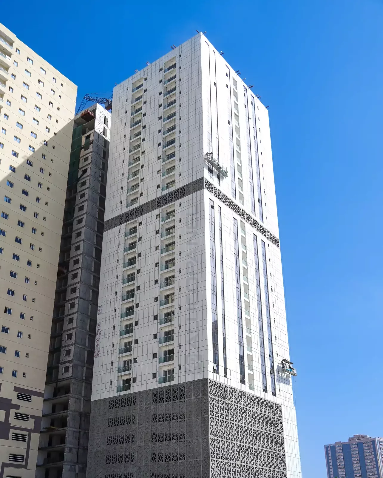 Ajman Res Tower facade with Islamic mashrabiya screen during construction
