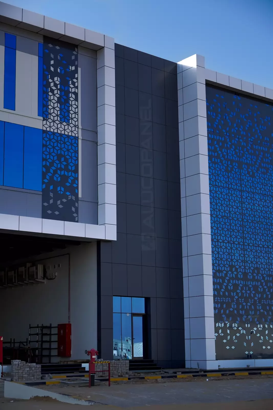 Entrance with perforated ALUCOPANEL screen at Landmark Offices and Warehouse