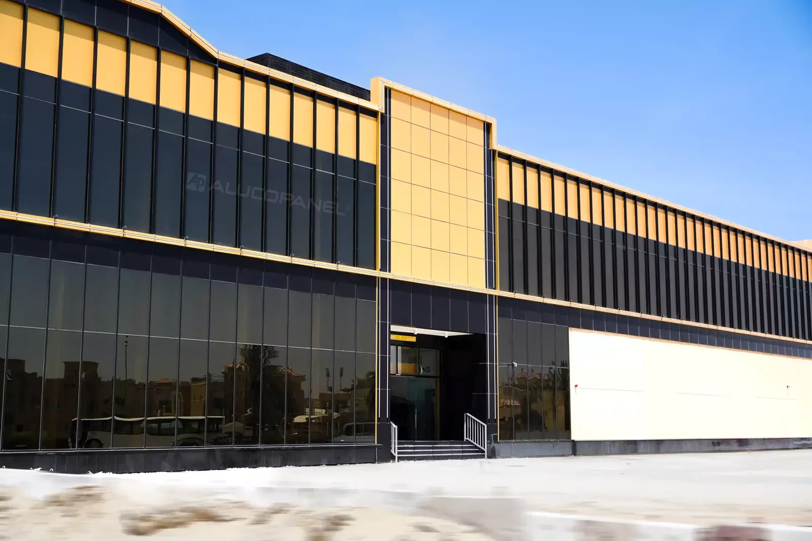 Moopans Mall entrance with gold and black ALUCOPANEL facade