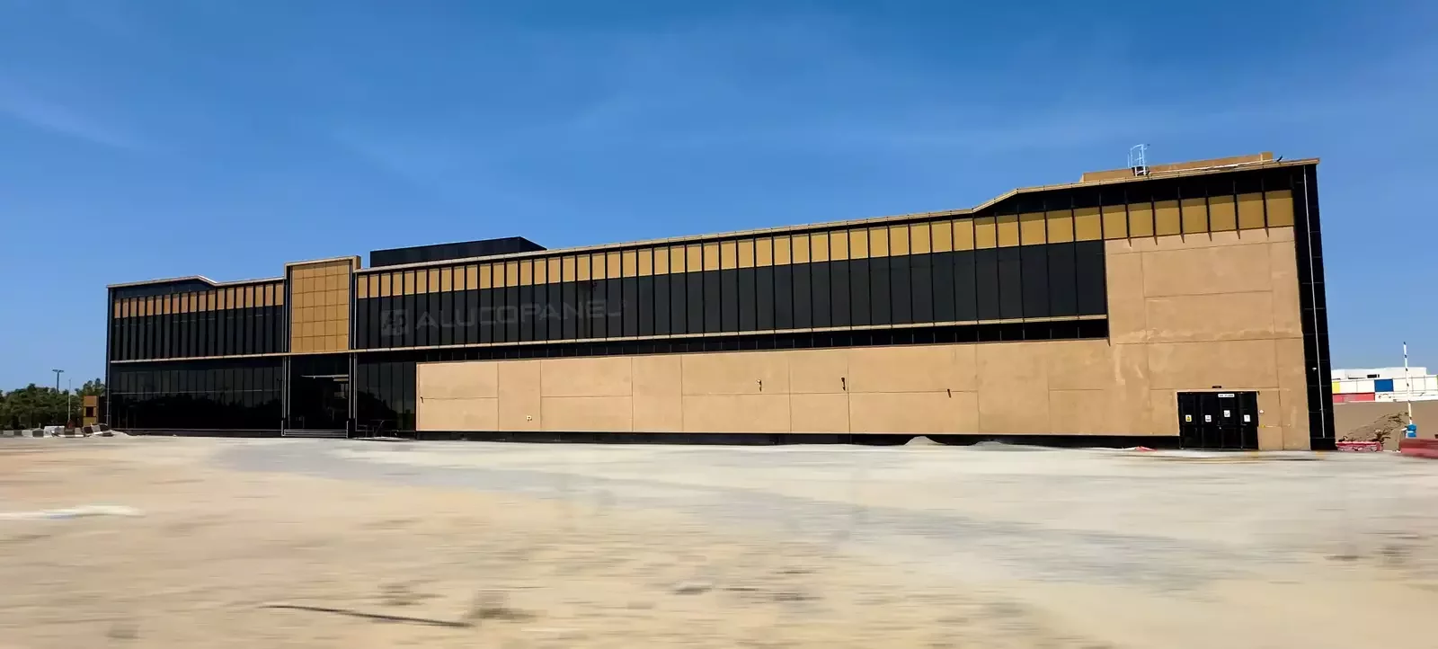Wide elevation of Moopans Mall clad with ALUCOPANEL, Al Khawaneej