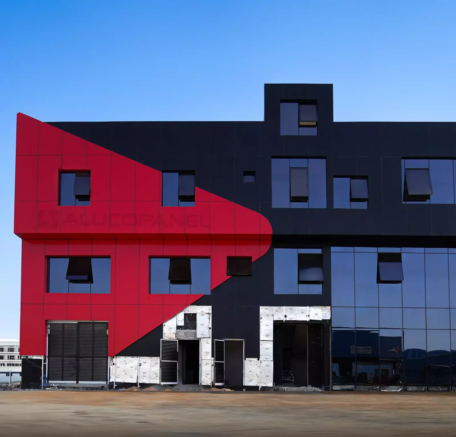 Red and black diagonal ALUCOPANEL FR facade, building front, Umm Al Quwain