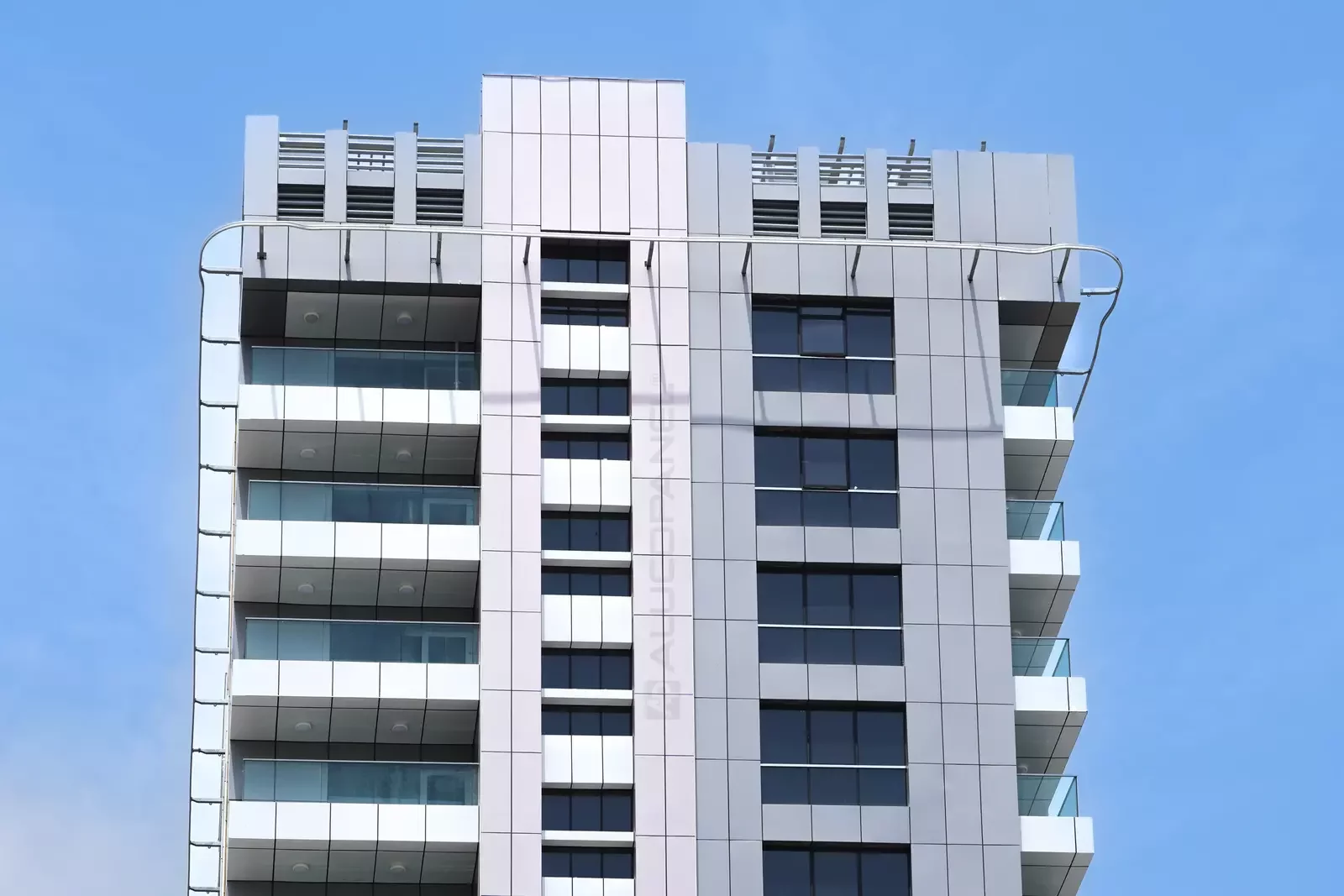 Corner elevation of the Al Falah Street commercial building clad with ALUCOPANEL