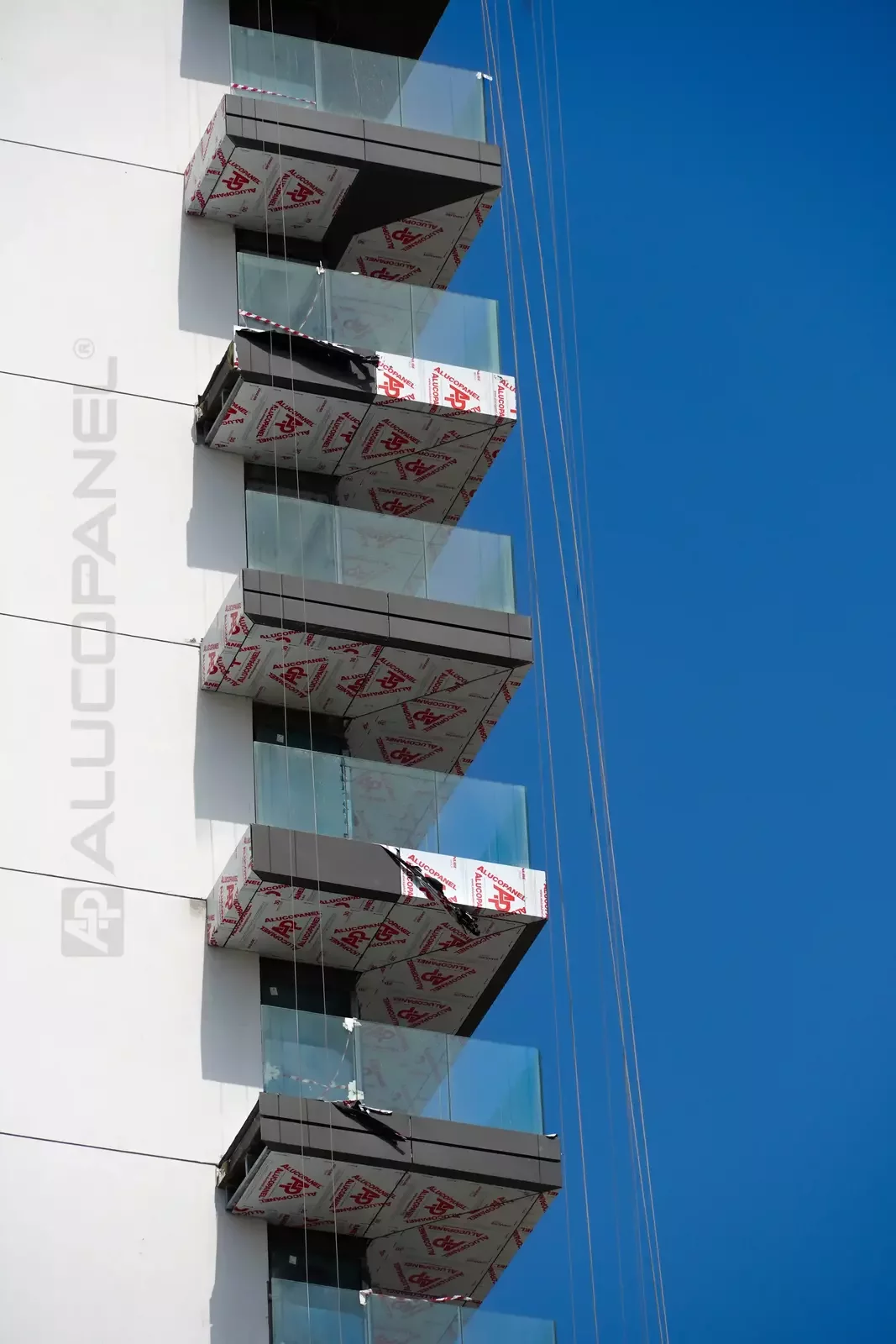 ALUCOPANEL panels with protective film on the balcony corners, Green Side Residences