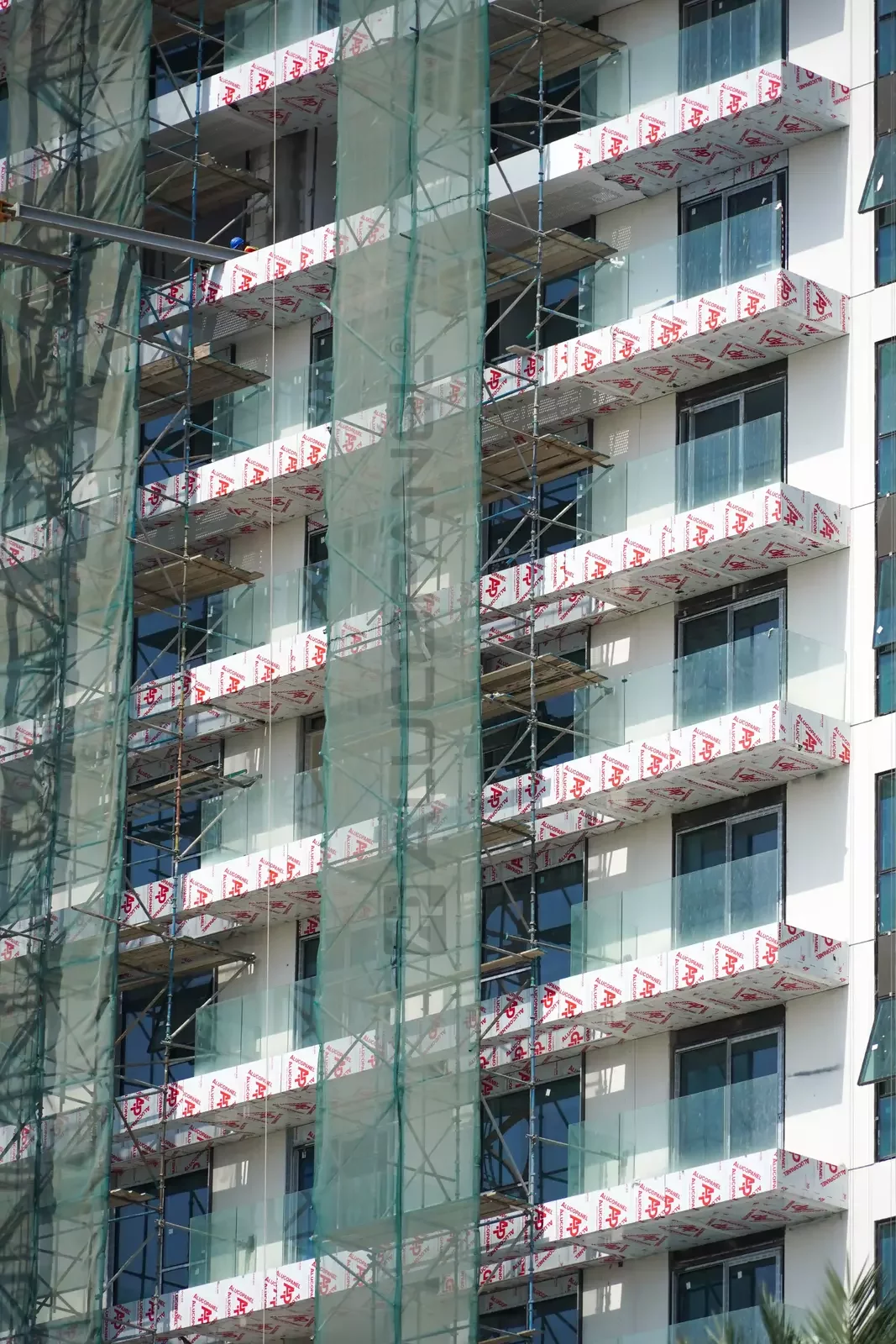 Twin towers of Green Side Residences in Dubai Hills, clad with ALUCOPANEL